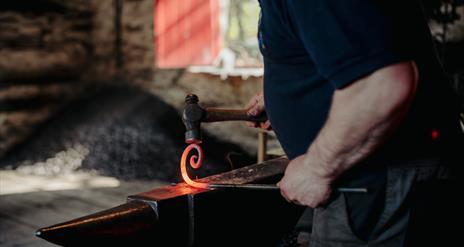a  blacksmith at ulster folk museum