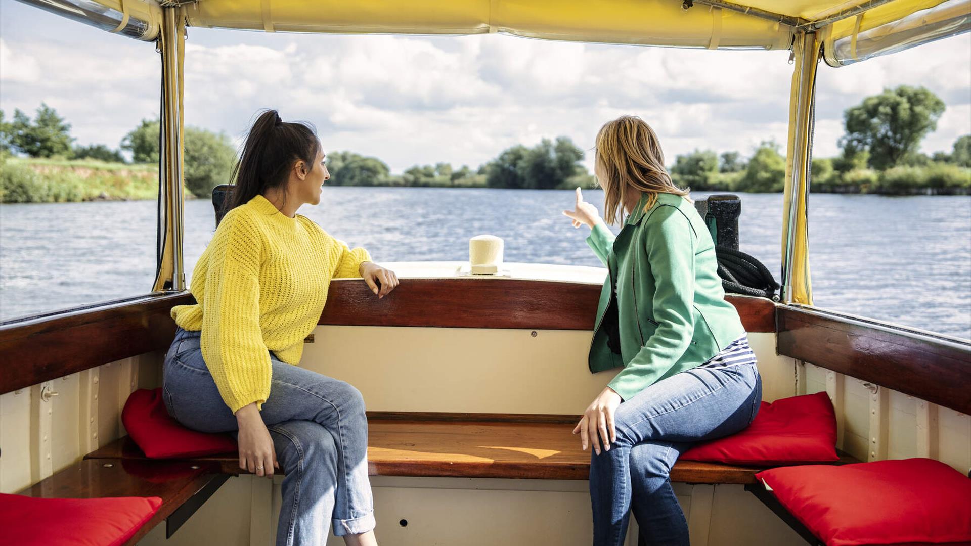 Guests onboard the M. V. Kingfisher admire the views as the boat floats along the River Bann