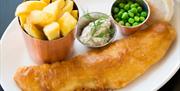 Belfast ale battered haddock with beef fat chips, home-made tartare sauce and garden peas