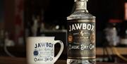 Jawbox Gin bottle and Jawbox Gin metal cup