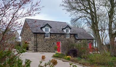 Stone cottage with red door - The Barn at Ballycairn