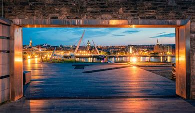 View of the Guildhall and Peace Bridge in Derry~Londonderry at night