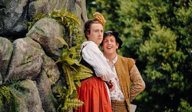 Two men in historical costume perform Twelfth Night.