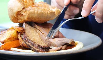 Beef Roast Dinner with Potatoes, Carrots and Yorkshire Pudding