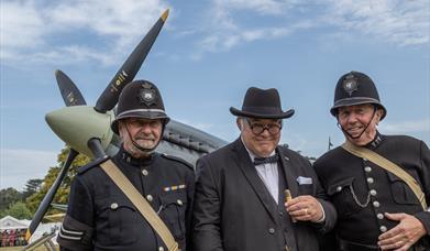 Re enactors with full size replica Spitfire at Holt