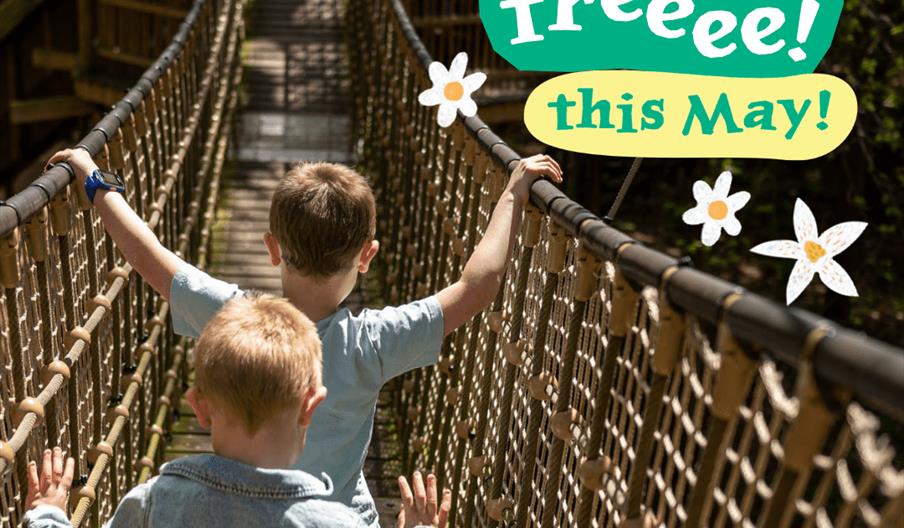 2 children on a wooden play bridge