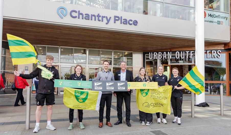 Paul McCarthy and Community Sports Foundation holding banners in Chantry Place