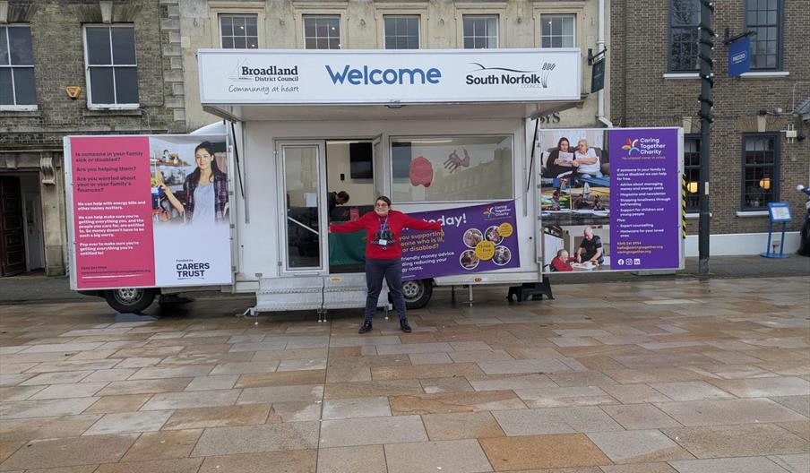 Caring Together Charity financial wellbeing co-ordinator Claire Rogers stood in front of the Carer Money Matters mobile office.