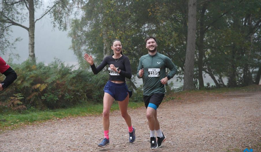 Two people taking part in the RunThrough event at Holkham