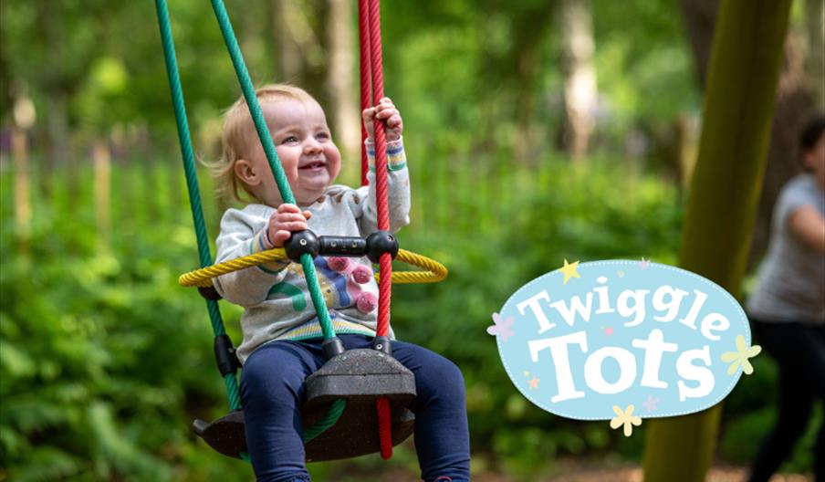 Toddler on swing at bewilderwood
