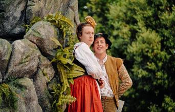 Two men in historical costume perform Twelfth Night.