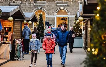A family exploring the Christmas Market