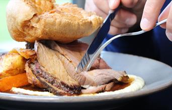 Beef Roast Dinner with Potatoes, Carrots and Yorkshire Pudding