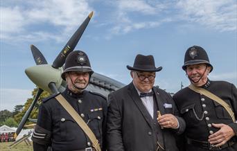 Re enactors with full size replica Spitfire at Holt