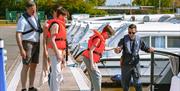 Family boarding their cruiser for a boating holiday at Stalham Marina