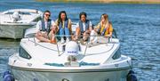 Group of friends on a cruiser in the Broads National Park