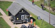 View down over the Horsey Staithe stores and tea room from Horsey Windpump.