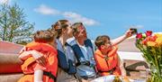 Family on a Cruiser in the Broads National Park taking a selfie