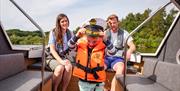 Family on a Day Boat in the Broads National Park