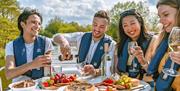 Group of friends enjoying lunch on a cruiser in the Broads National Park