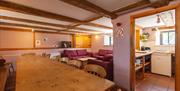 Granary sitting room & dining room at Deepdale Camping & Rooms