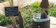 Scene showing a fairy house on the Blossom Fairy Trail at Horsey Windpump, Norfolk