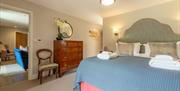Besley Suite Bedroom with view to Sitting Room
