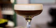Try cocktails at Eric's Pizza in Holt