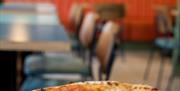 Crisp sharp design of pizza and restaurant by Fred Bambridge of Eric's Pizza