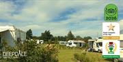 Motorhomes, campervans and tents at Deepdale Camping & Rooms on the beautiful North Norfolk Coast