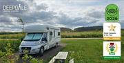 Motorhome on a Woodview pitch at Deepdale Camping & Rooms on the beautiful North Norfolk Coast