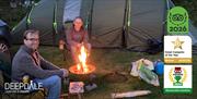 Enjoying a fire pit on the campsite at Deepdale Camping & Rooms on the beautiful North Norfolk Coast