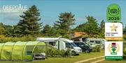 Campervans, motorhomes and tents at Deepdale Camping & Rooms on the beautiful North Norfolk Coast