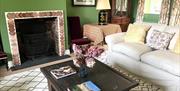 The lounge at Washmeres Cottage, a holiday let on the Houghton Hall Estate in Norfolk, UK