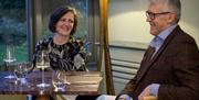 Relaxed dining in Titchwell Manor's conservatory serving 3 AA rosette food