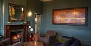 Titchwell Manor's relaxed lounge to sip win and drink coffee