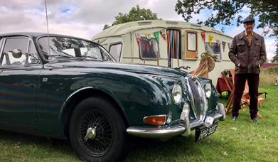 1960s Jaguar and caravan