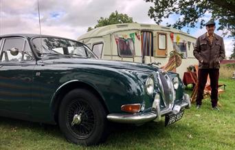 1960s Jaguar and caravan