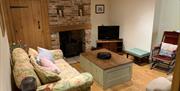 Sunny Dene Cottage Living room with wood burner