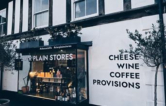 Star Plain Stores shop front showing Cheese, Wine, Coffee and Provisions signage in Holt