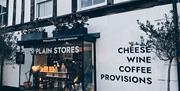 Star Plain Stores shop front showing Cheese, Wine, Coffee and Provisions signage in Holt