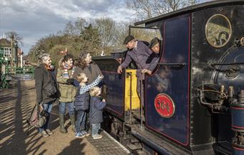 A family speaks with the steam loco crew