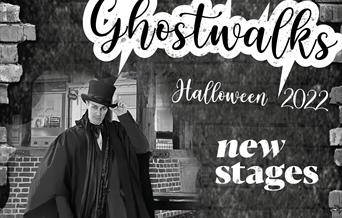 Ghost Walks image with walk leader Joseph Ballard in top hat and cloak.
