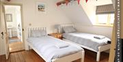 Twin bedroom
This light & airy spacious bedroom is accessed from either the Master or double bedrooms making ideally suited to children. It offers two