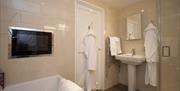 Luxurious ensuite with TV above bath !