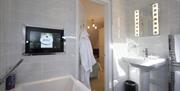 Luxury ensuite bathroom with TV