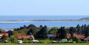 Views of Brancaster Staithe Harbour and Scolt Head Island over Deepdale Camping & Rooms