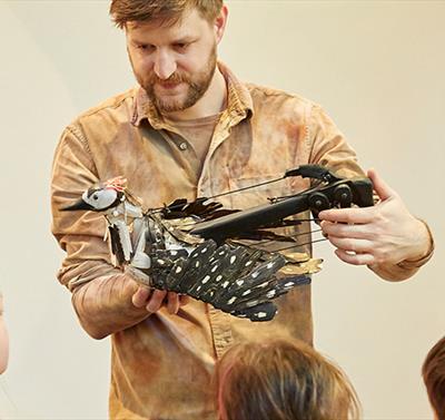 man presenting a workshop to children