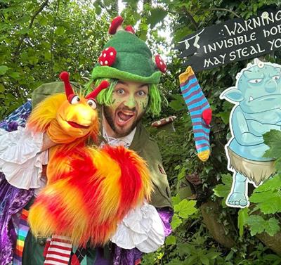 Man dressed up in front of a forest