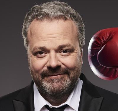 Hal Cruttenden being hit with a boxing glove